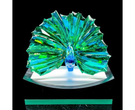 This stunning peacock shines in a combination of faceted clear, blue, and green crystal with an Aurora Borealis effect. Made 
