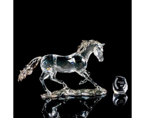 Annual edition piece made from clear crystal with satin crystal mane and tail. Plaque is engraved with figure title and artis