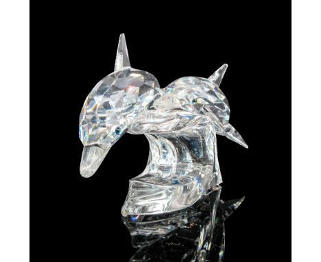 From the SCS collection. Faceted crystal figurine modeled as a dolphin riding a wave with her calf. SCS acid mark and dated d