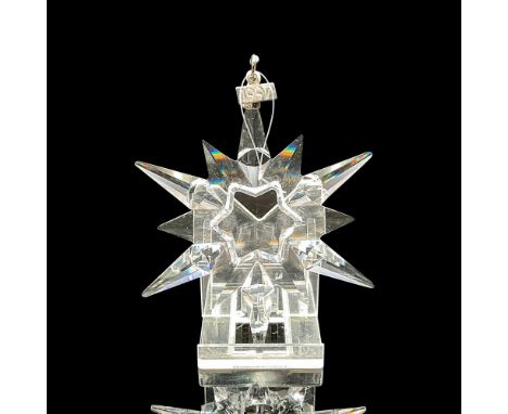 Clear crystal 12-pointed snowflake designed for the annual ornament. Blue satin ribbon included for hanging. Swarovski backst