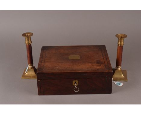 A Regency rosewood box, a single compartment mahogany tea caddy, and a pair of 8 inch brass candlesticks with mahogany shaft 