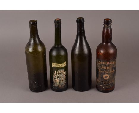 A collection of nine vintage bottles, one a Champagne bottle with contents, a wine bottle with contents, an empty Cockburn's 