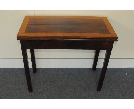 A 19th century mahogany and satinwood card table, rectangular top on square supports, with inlay to folding top 