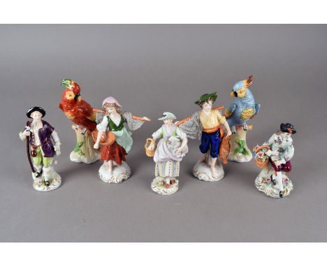 An assortment of Sitzendorf figures, comprising a pair of parrots, fisher children, a lady and a lamb plus two others, plus t