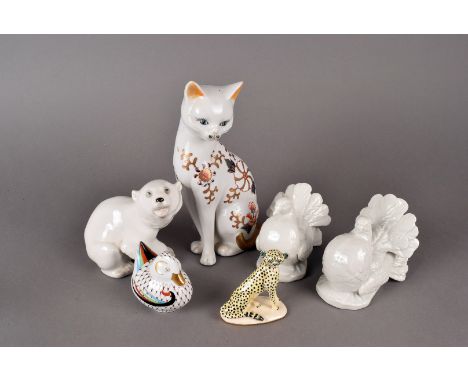 A Basil Matthews ceramic Cheetah figure, plus a pair of blanc-de-chine fan tailed pigeons, a USSR made polar bear, a Chinese 