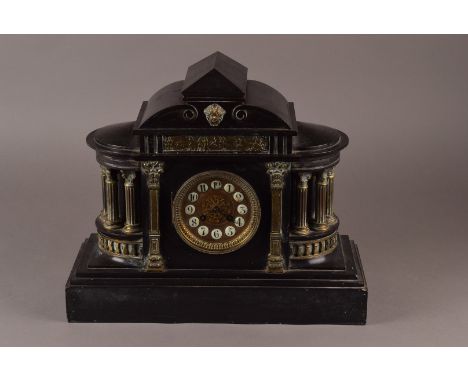 A Large Slate mantle clock, with ornamental brass columns and central frieze, porcelain Arabic button numerals, 8 day French 