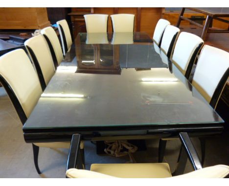 An original Art Deco black lacquer dining suite, the table with lyre shaped base and two later extending leaves, is complete 