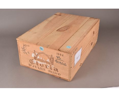 A case of 12 bottles of Chateau Gloria St. Julien 1982, this red Bordeaux is presented in its original wooden box (12) 