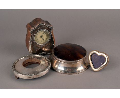 A George V silver and faux tortoiseshell jewellery box, the fitted interior, together with a silver front mantle clock and tw