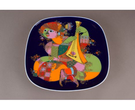 A Bjorn Wimblad for Rosenthal porcelain charger, with brightly coloured lute player design to a royal blue ground, fully mark