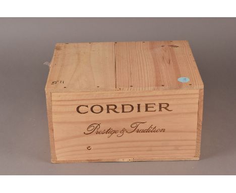 A case of 6 bottles of Chateau Tanesse Cotes de Bordeaux Rouge 1998, this red Bordeaux is presented in its original wooden bo