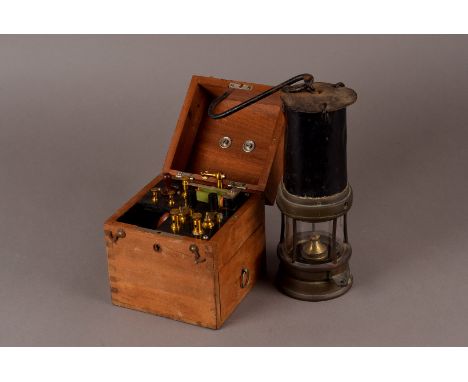 A vintage brass and steel Miners lamp, together with a Hancock & Co, Bath, electric shock machine in mahogany box and a Chine