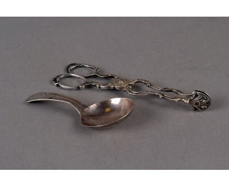 A George III silver tea caddy spoon by EM, with bright cut handle and inscription, together with a pair of early 19th century