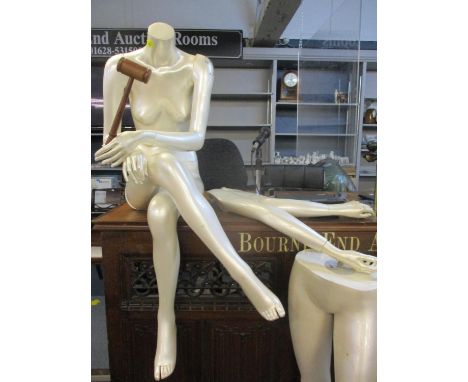 A cream pearlescent female mannequin with extra parts to create a seated or standing mannequin 
