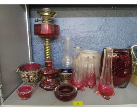 A selection of Victorian and later glassware to include a brass and cranberry glass oil lamp and shade 