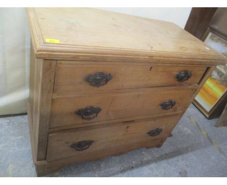 A late Victorian pine chest of three long drawers standing on bracket shaped feet 77.5h x 90cm w 