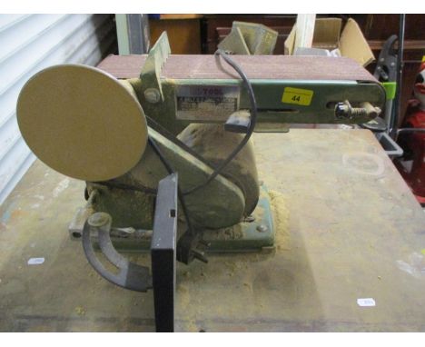 A Nutool 4" belt and disc sander mounted on a table 