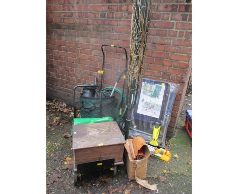 Tools and outdoor equipment to include an outdoor chair, sprinkler, folding washing line, a wooden box together with a Hutter