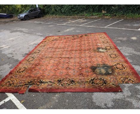 A late 19th century Turkish carpet with repeated motifs, A/F, approx 16' x 13' 