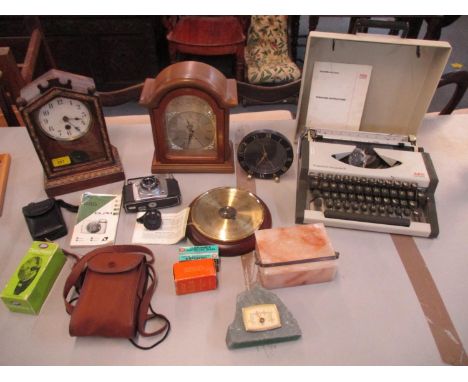 A mixed lot of cameras, mantle clocks, a wall hanging barometer and a cased AEG Olympia traveller de luxe S typewriter 