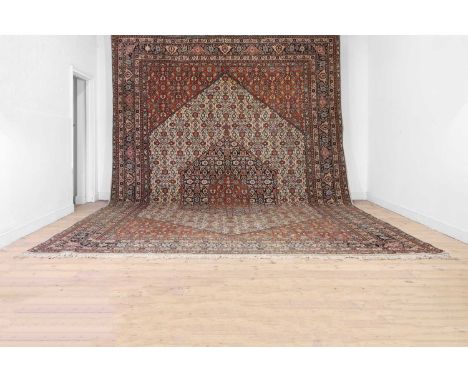 A large Bidjar wool carpet, 20th century, woven with repeating Herati motifs to a cream ground,515 x 347cmCondition ReportSom