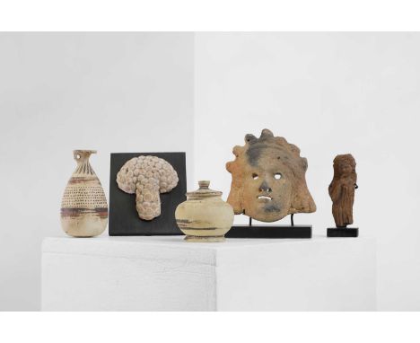 A group of five small antiquities, comprising:a terracotta votive mask, c.1st century BC/AD, possibly Alexandria,12cm wide,an