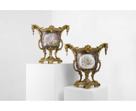 A pair of Sèvres-style ormolu-mounted porcelain cachepots, late 19th/early 20th century, French, the decoration French or Aus
