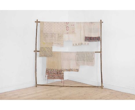 A group of embroidered linens, 19th century and later, comprising a Greek linen napkin with densely decorated borders in meta