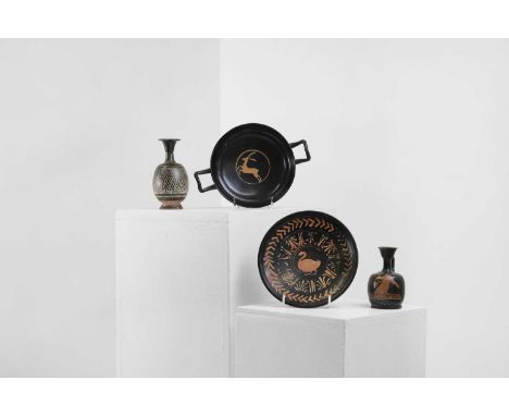 A group of four Apulian pottery antiquities, c.4th century BC, South Italian, comprising:a red figure swan, ring-footed dish,