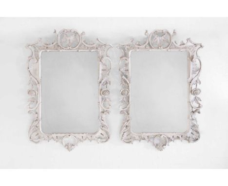A pair of George III-style painted wooden mirrors, 20th century, each decorated in the Chippendale taste with a scrolling fra