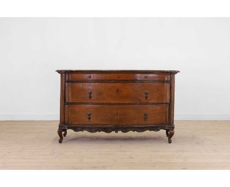 A walnut commode or cassettone, second half of the 18th century, North Italian, probably Veneto, with a shaped top above thre