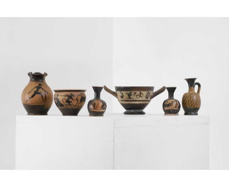 A group of six small classical pottery vessels, comprising:a pair of miniature red figure lekythoi, c.4th century BC, Greek f