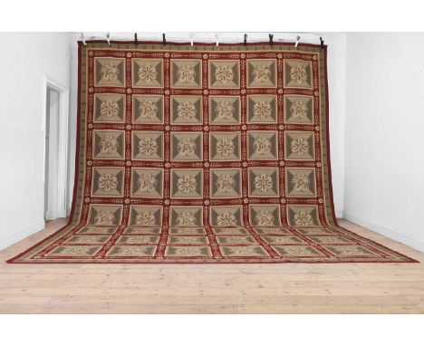 A needlepoint wool carpet of Robert Adam design, 20th century, Continental, in neoclassical style, woven with a repeating sta