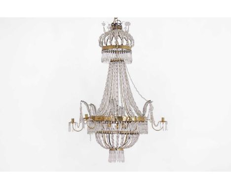 An Empire style cut-glass and gilt brass chandelier probably late 19th century and later, Swedish or Northern European, of te