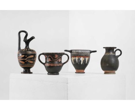 A group of four classical pottery antiquities, South Italian, comprising:a Gnathian juglet, c.3rd century,10cm high,a Gnathia