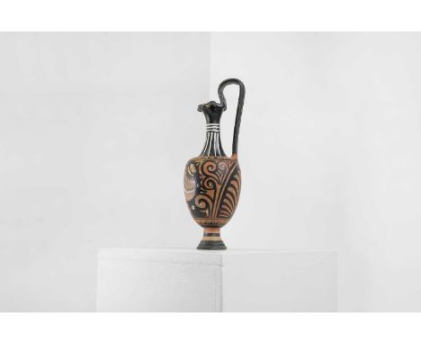 An Apulian classical red-figure trefoil oinochoe, c.350-330 BC, South Italian, painted with a profile female head wearing a p