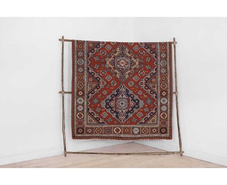 A flatweave kilim late 19th/early 20th century, probably Azerbaijani, Caucasus, the central field woven with three medallions