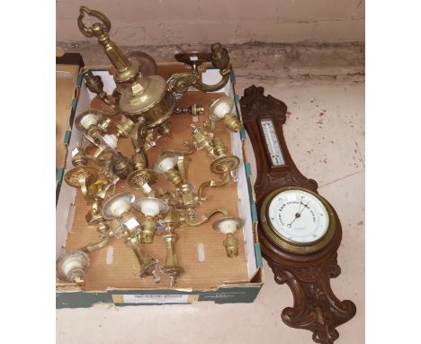 A Jacobean style carved oak cased barometer by Lloyd Payne &amp; Amil of Manchester; A three branch brass ceiling light and a