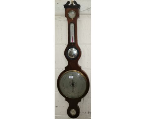 An early 19th century mercury column barometer in banjo shaped mahogany case, with level, mirror, thermometer and hygrometer 