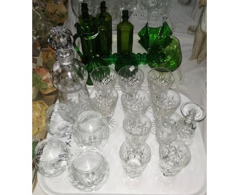 A cut glass thistle decanter; a selection of cut glasses; a quantity of green glass 