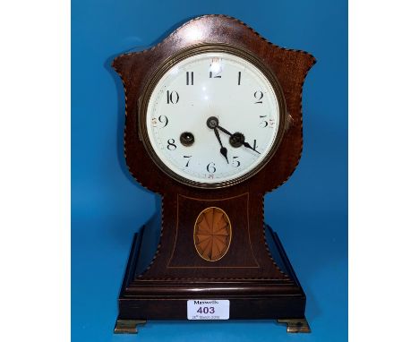 An Edwardian inlaid mahogany tulip shaped mantel clock with French striking drum movement 