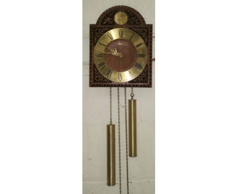 A reproduction wall hanging oak clock with twin brass weights; a reproduction mahogany barometer 