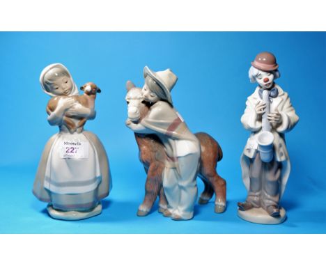 A Nao figure of a girl with calf; A Lladro boy with donkey (minor chip to hat rim) &amp; a clown with saxophone 