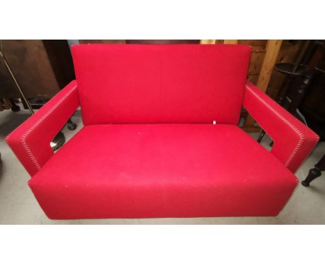 A Cassina two seater settee in red fabric with stitchwork to the arms, designed by Gerrit Thomas Rietveld 637 Utrecht Sofa, w