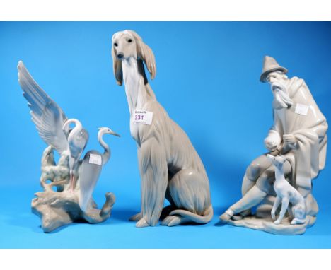 A Lladro tall figure of a seated afghan hound, height 12"; a Nao group of 2 herons 