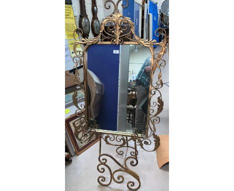 A wall mirror in wrought gilt metal frame; an easel; a Turkish hookah pipe; a wall sculpture; a silver framed mirror 