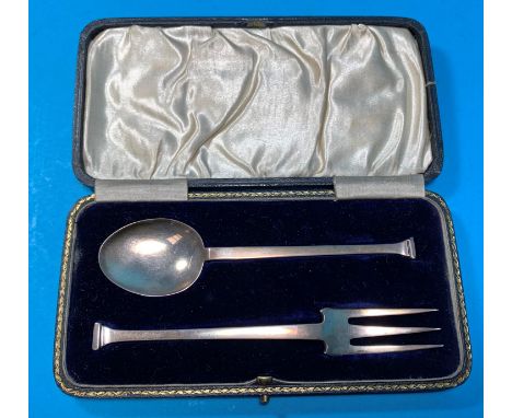 An Arts &amp; Crafts silver fork and spoon set, Birmingham 1918, cased, maker HCD; an early 19th century caddy spoon 