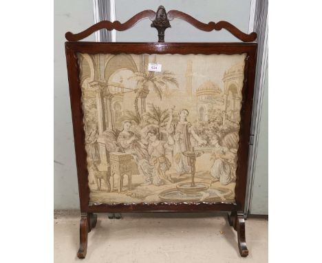 A mahogany framed firescreen with tapestry panel 