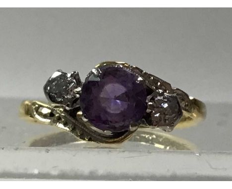 AMETHYST AND DIAMOND THREE STONE CROSSOVER RING, IN EIGHTEEN CARAT GOLD along with two gemset rings, a signet ring and two we