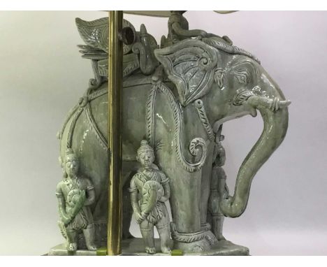 CERAMIC FIGURAL TABLE LAMP the lamp modelled as an eastern elephant with soldiers surrounding71cm high
